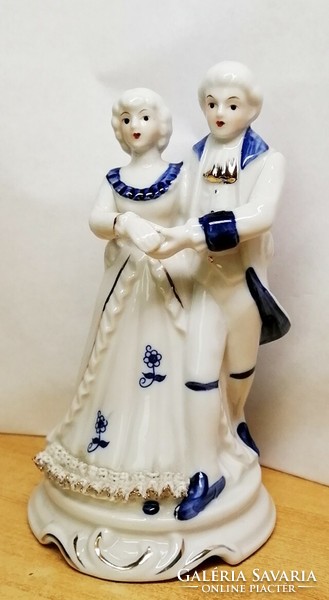 Dancing couple. Porcelain nip. Baroque style with blue painting