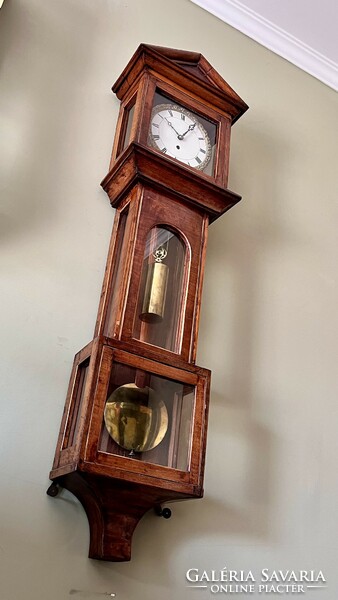 A heavy wall clock in Flemish style