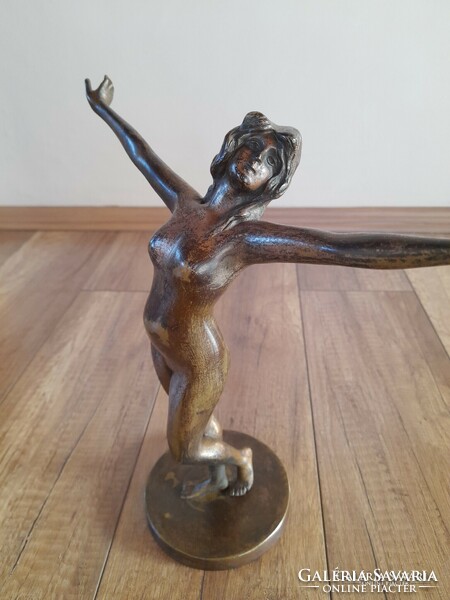Old bronze dancing nude statue