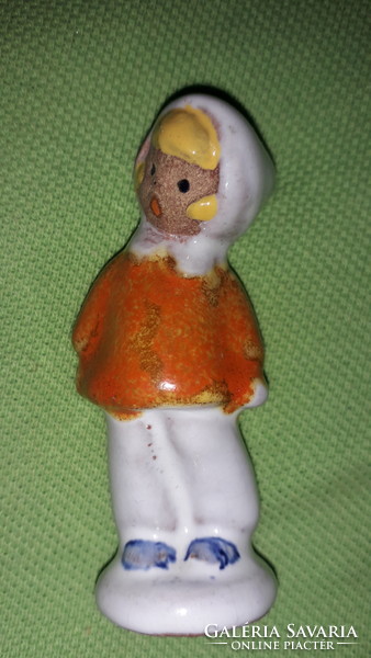 Antique tiny hoppy glazed ceramic little girl in winter clothes standing in the snow, extremely rare 7cm as in the pictures