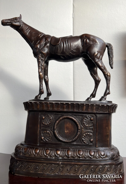 Horse bronze statue on a classical bronze platform