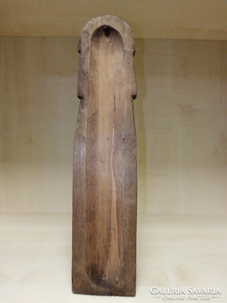 Carved wise man with a cross