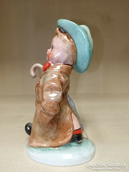 Art ceramic little boy with an umbrella