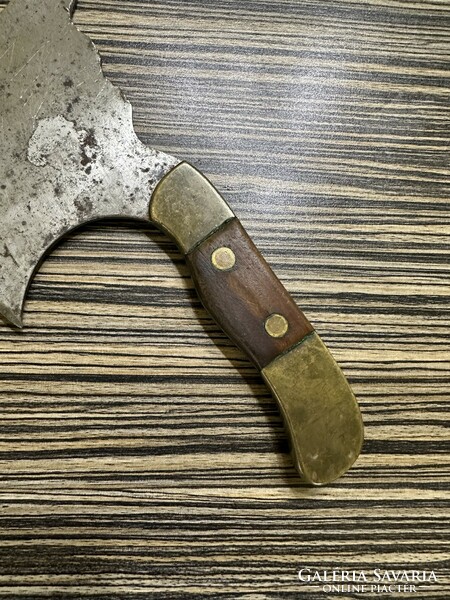 Old meat cleaver with brass and wooden handle
