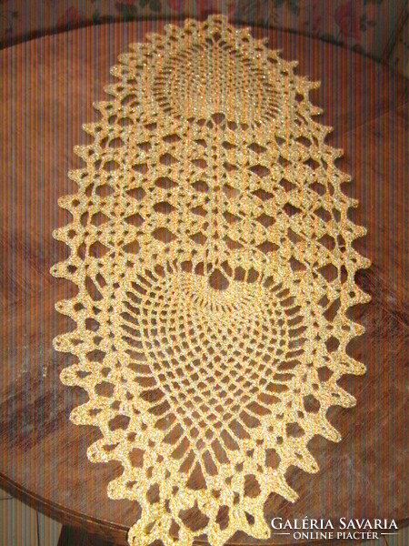Beautiful hand-crocheted shiny golden tablecloth