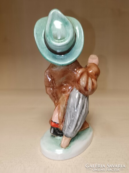 Art ceramic little boy with an umbrella