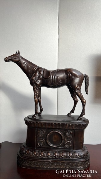 Horse bronze statue on a classical bronze platform