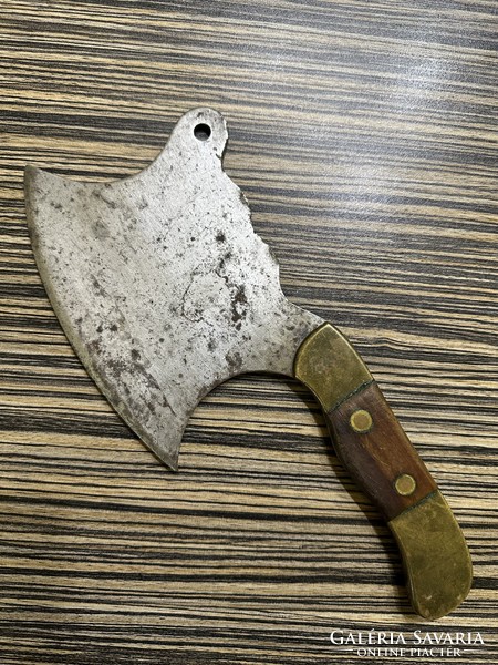 Old meat cleaver with brass and wooden handle