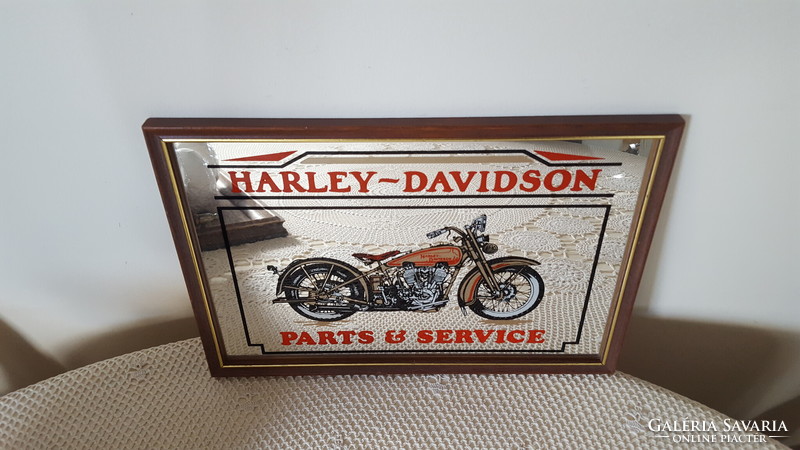 Harley Davidson advertising mirror image, in a wooden frame