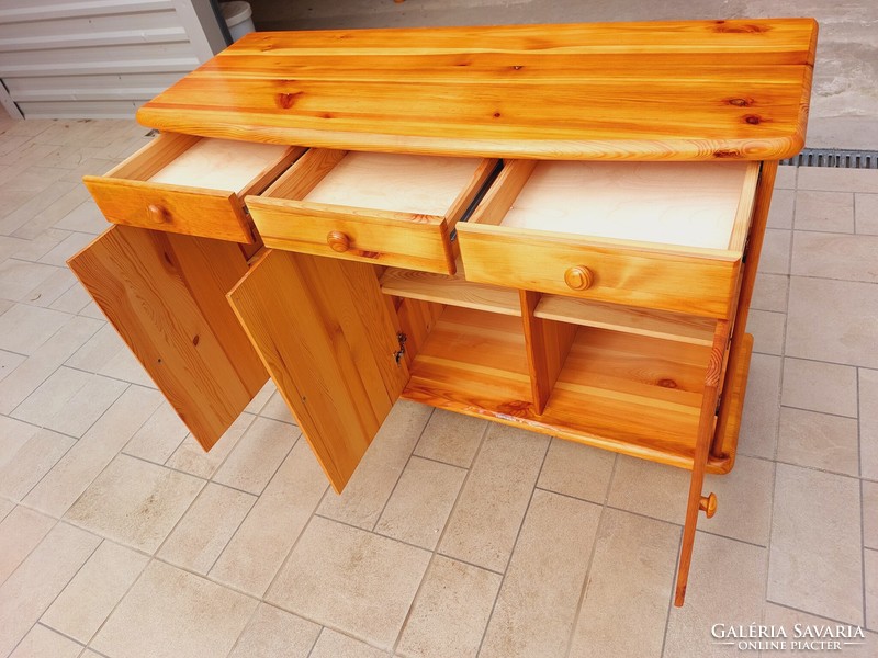 A pine dresser with 3 drawers and shelves is for sale. Furniture is in nice, new condition. Dimensions: 117 cm x 43 cm core