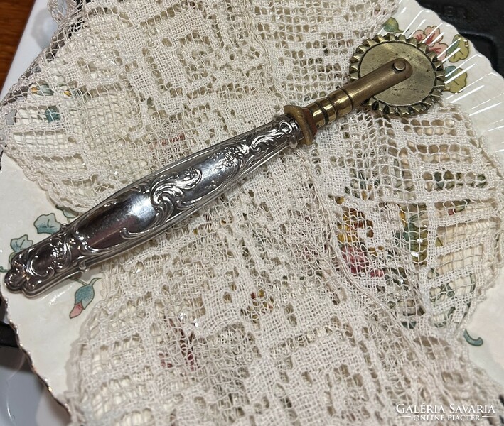 Antique silver, copper-headed brass cutter