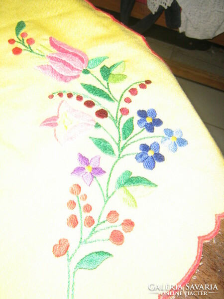 Runner of Kalocsa embroidered tablecloth on a beautiful yellow background