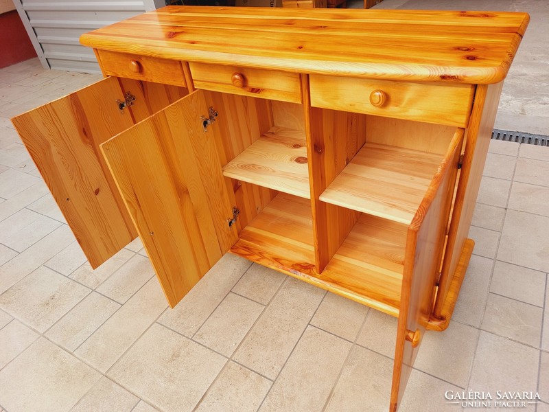 A pine dresser with 3 drawers and shelves is for sale. Furniture is in nice, new condition. Dimensions: 117 cm x 43 cm core