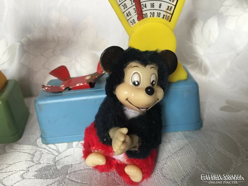Old, retro toys-in-a-doll, dollhouse scales, mickey mouse donuts, chirping clockwork hen