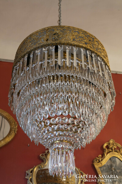 Crystal chandelier in the shape of a half bulb with an openwork frame