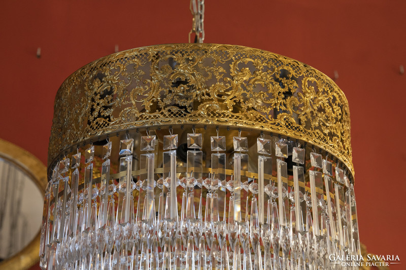Crystal chandelier in the shape of a half bulb with an openwork frame