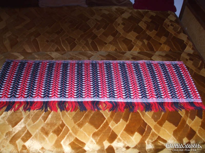 Red and black patterned wall protector on a white congress, for hubs and tables, not used
