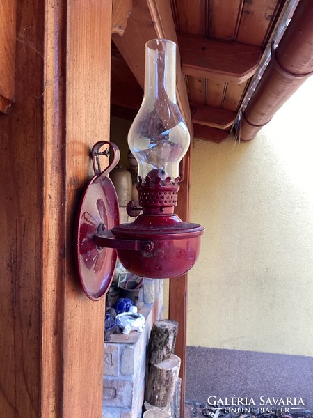 Burgundy kerosene lamp.