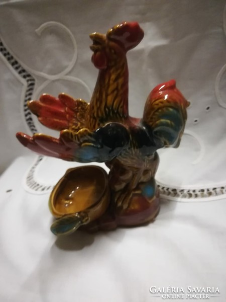 Glazed ceramic candle holder with a rooster figure