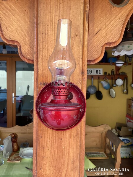 Burgundy kerosene lamp.