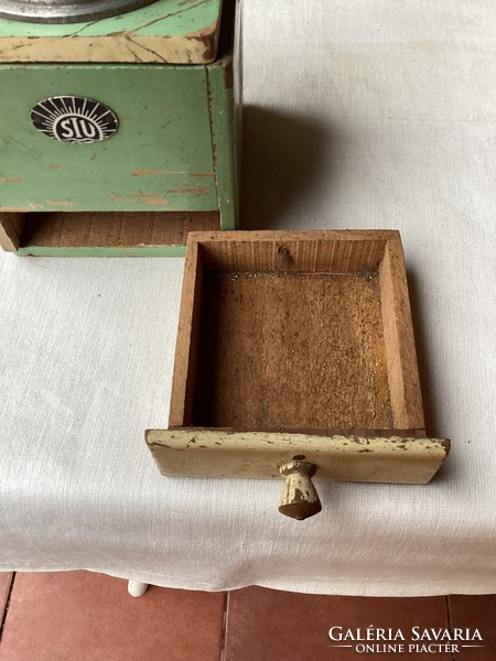 Old wooden coffee grinder.