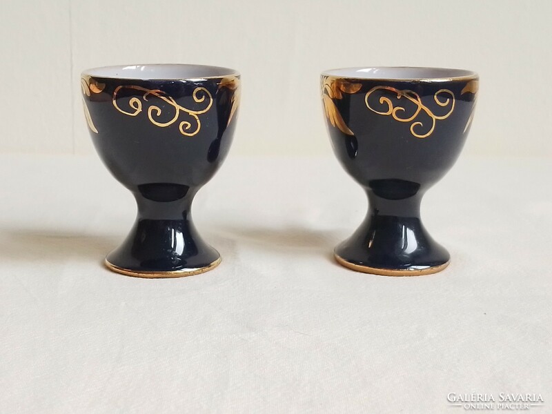 Two antique old hand-painted cobalt blue gold flower pattern glazed ceramic cups, egg holder