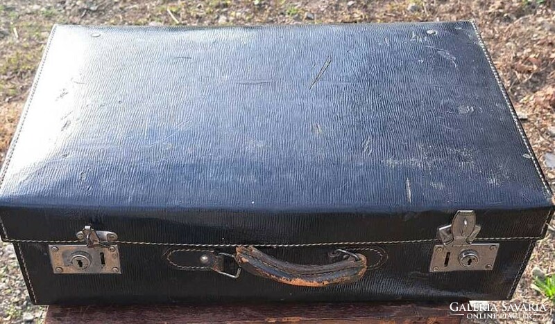 Antique black suitcase with defective handle