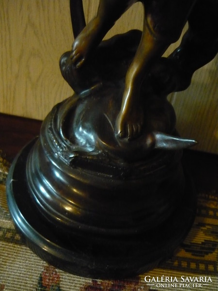 Beautiful bronze statue on a marble plinth