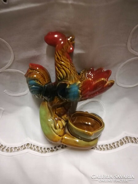 Glazed ceramic candle holder with a rooster figure