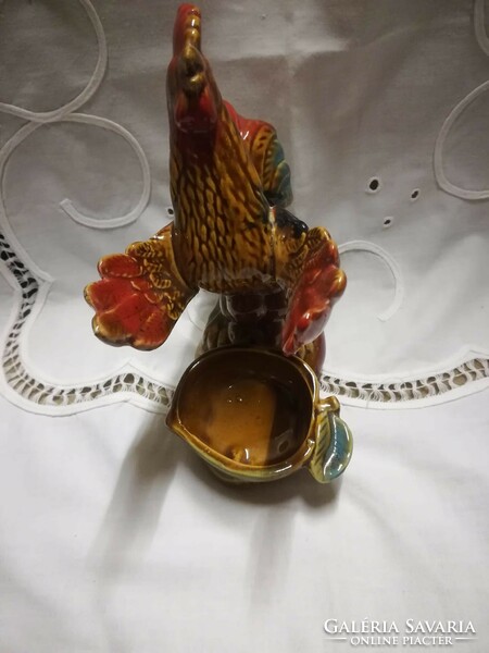 Glazed ceramic candle holder with a rooster figure