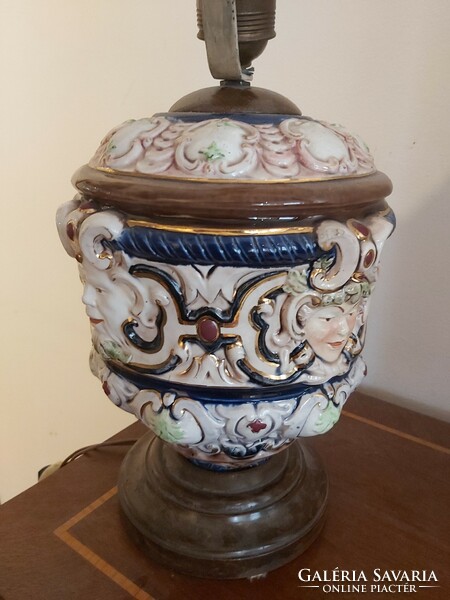 Antique majolica table lamp with turned wooden base and parchment shade