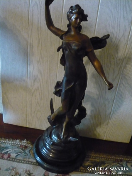 Beautiful bronze statue on a marble plinth