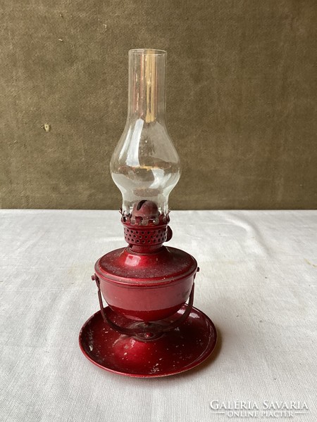 Burgundy kerosene lamp.