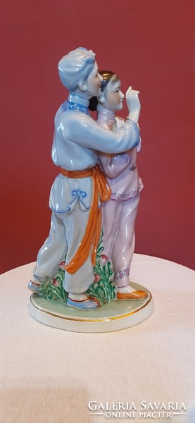Chinese young couple. Marked original, hand-painted porcelain statue. 28 cm high.
