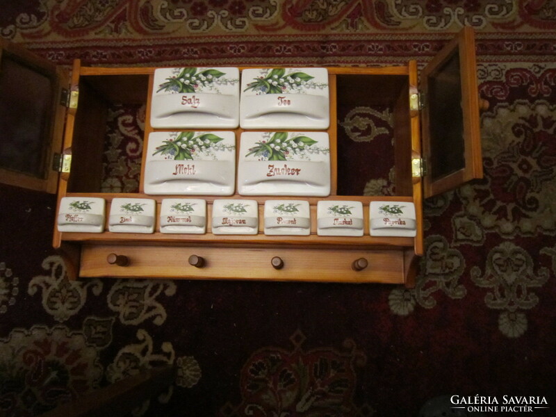 Wall-mounted wooden spice rack with lily-of-the-valley spice holder