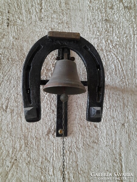 Antique copper gate bell with wrought iron horseshoe