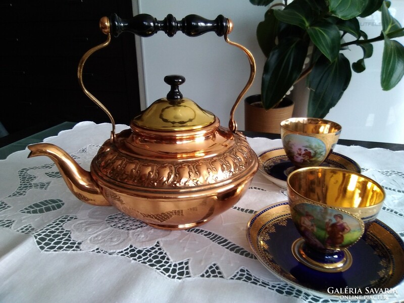 Old copper teapot with hammered pattern with wooden tongs, beautiful design!