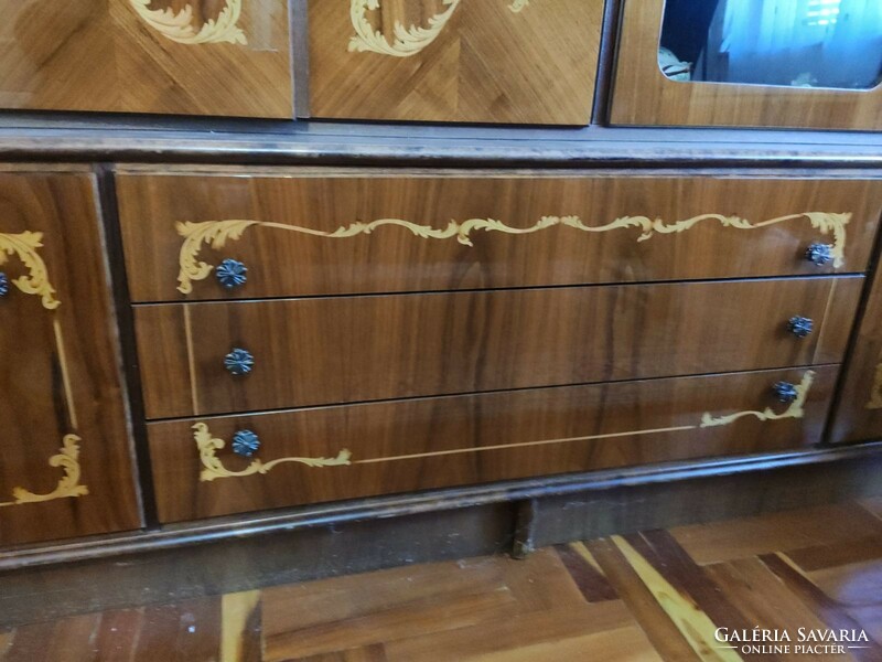 Cabinet line with intarsia decoration.