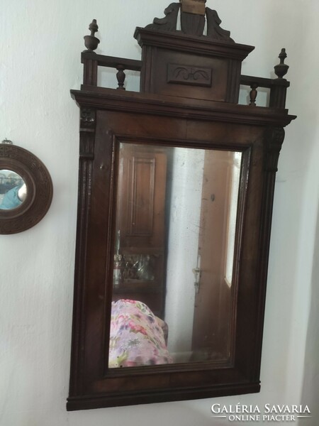 A mirror made in the tin German style.