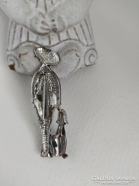 Vintage silver colored brooch - lady in hat with dog