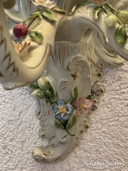 Beautiful antique large two-armed porcelain candle holder with applied flowers