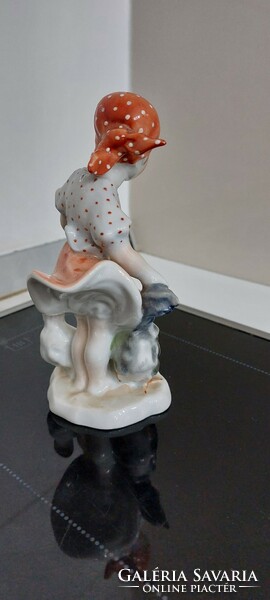 Porcelain figurine of a little girl feeding a Herend hen