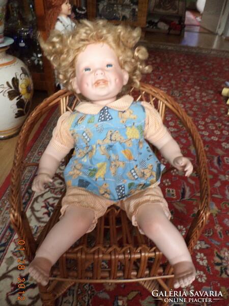 Large smiling, numbered porcelain doll!
