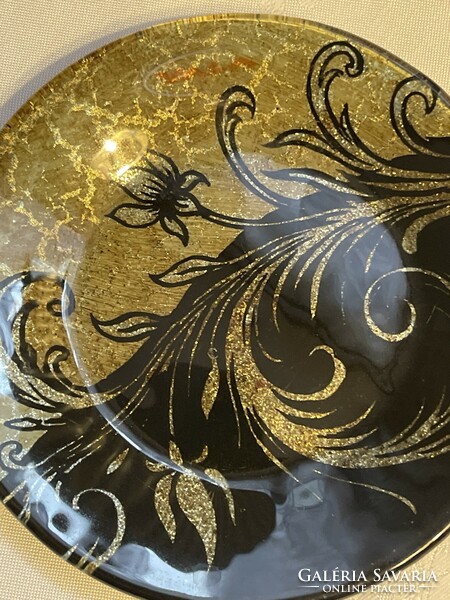 Richly gilded glass decorative plate.