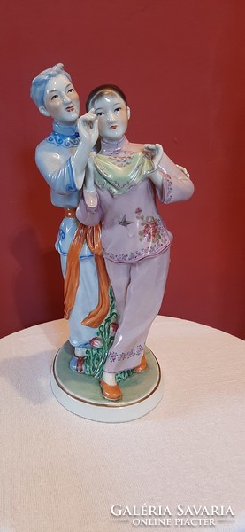 Chinese young couple. Marked original, hand-painted porcelain statue. 28 cm high.