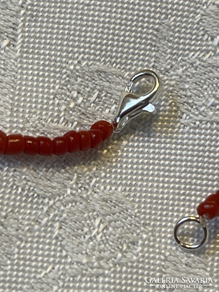 Beautiful genuine cinnabar necklace with coral and silver clasp.