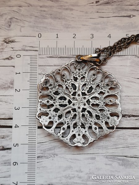 Silver-plated craftsman (?) pendant on a chain