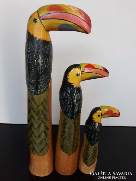 3 Carved and painted wooden toucan statues