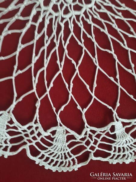 Delicate crocheted lace tablecloth