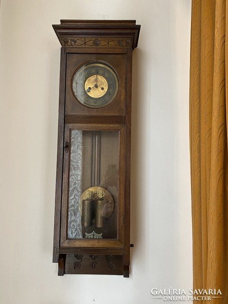 Tin German wall clock from the beginning of 1900